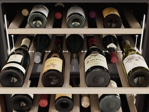 Wine bottles kept on shelves